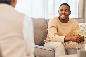 a person speaks with a therapist in one of many mental health treatment programs