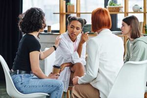 a group of women talk in a womens rehab program