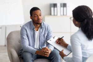 a person talks to a therapist during anxiety treatment