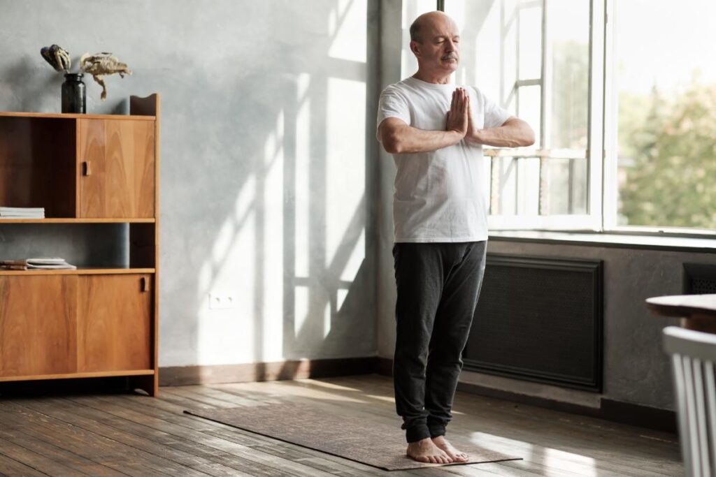 a man uses self care activities like mediation to combat depression