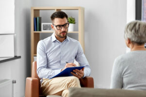 A doctor making a medical referral for addiction treatment