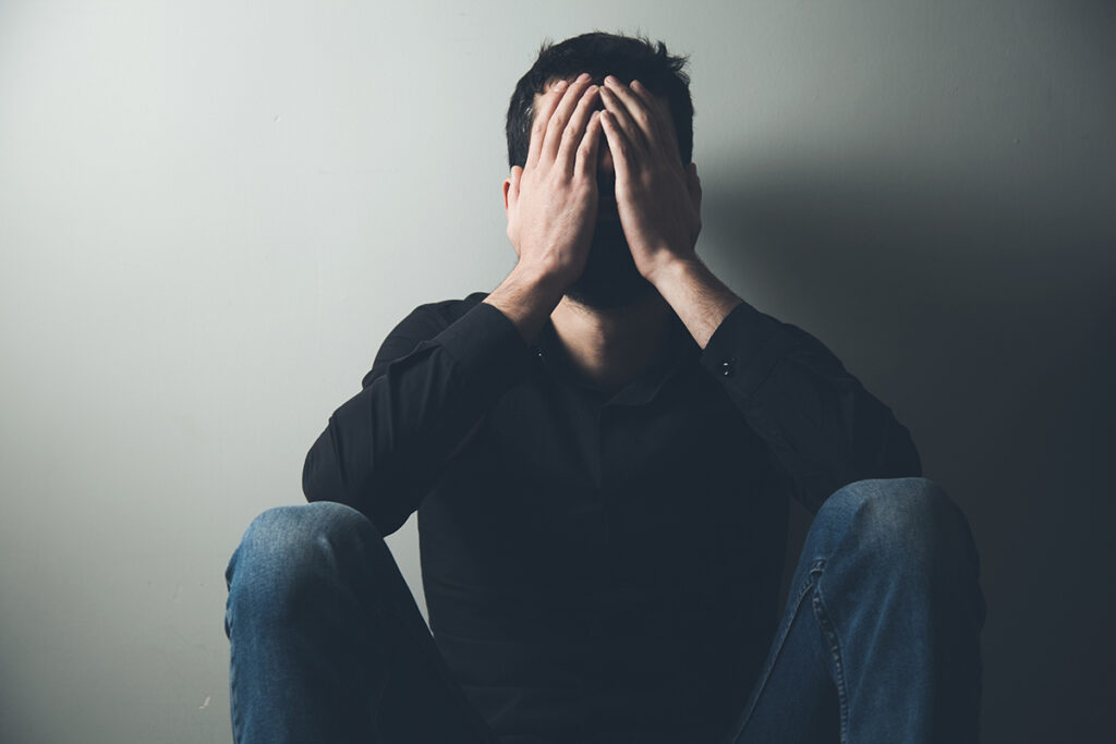 a man struggles to conceal signs of his addiction